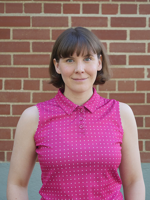 A photo of the author with bangs and a bob